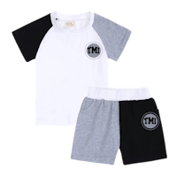 a white and black t - shirt and shorts set