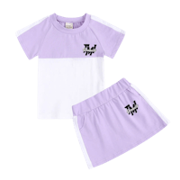 a purple and white t - shirt and skirt set