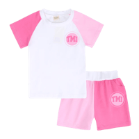 a white and pink t - shirt and shorts set